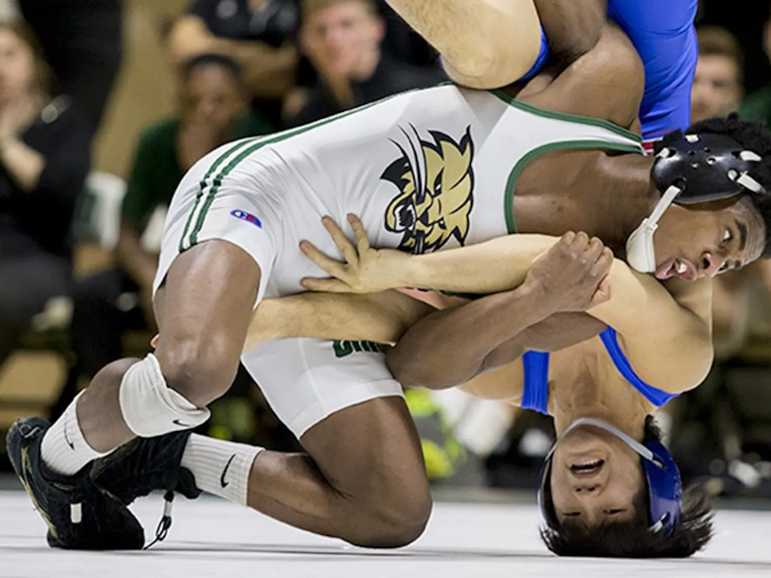 Ohio University's Shakur Laney pins down American University's Josh Terao during Ohio's match Sunday.