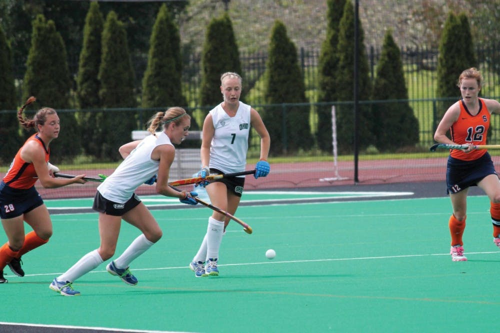 Field Hockey coach teaches flexibility  