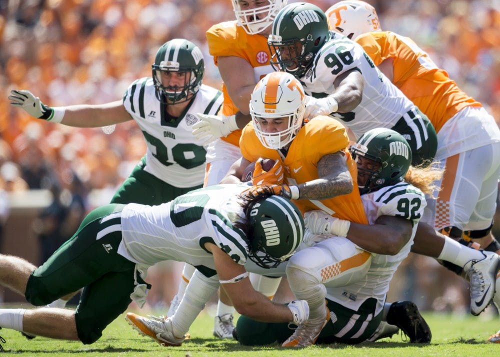 Redshirt junior defensive lineman Cleon Aloese (#92) and redshirt junior linebacker Cody Grilliot combine for a tackel against Tennessee on Saturday, September 17 in Knoxville, Tennessee. 