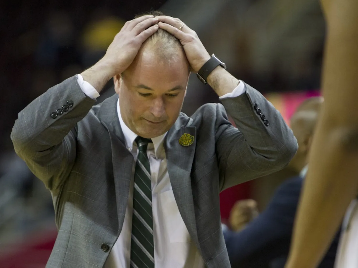 Ohio head coach Saul Phillips hangs his head in disbelief after a foul was called in Kent State's favor late in the second half of the Bobcat's 68-66 loss in the MAC Tournament semifinal.
