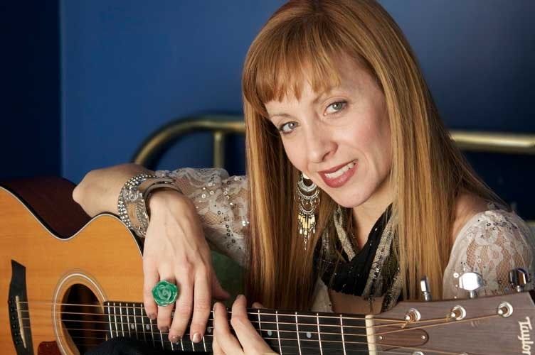 Local band's lead singer performing own songs  