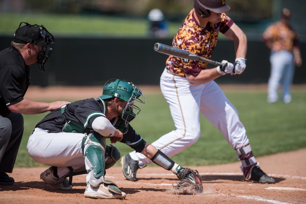 Ohio catcher Nick Bredeson stops the ball on the ground during the Bobcats’ game against Central Michigan on April 9.
