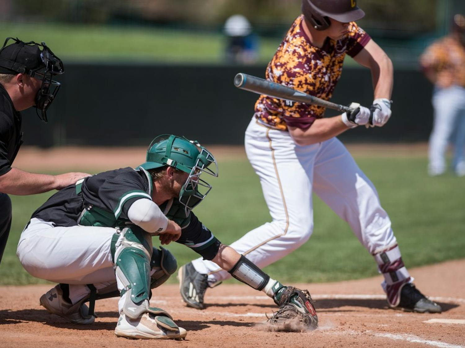 Ohio catcher Nick Bredeson stops the ball on the ground during the Bobcats’ game against Central Michigan on April 9.