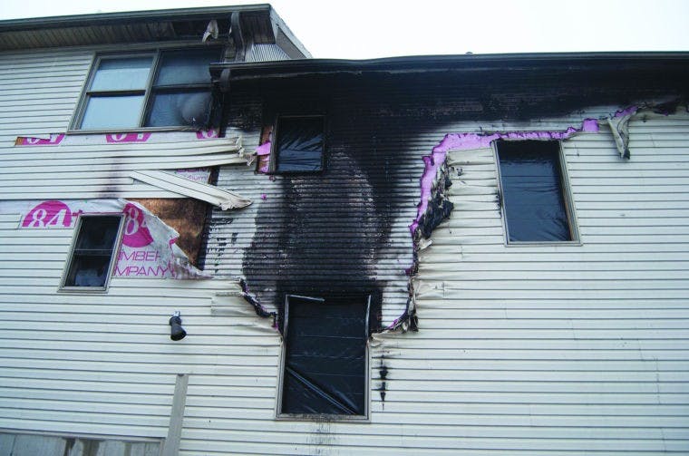 Investigators looking for two men linked to house fire  