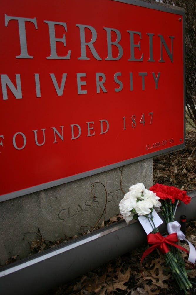 	In memoriam of Kyle Miller: Flowers had been placed by the Otterbein sign on Towers’ lawn. 