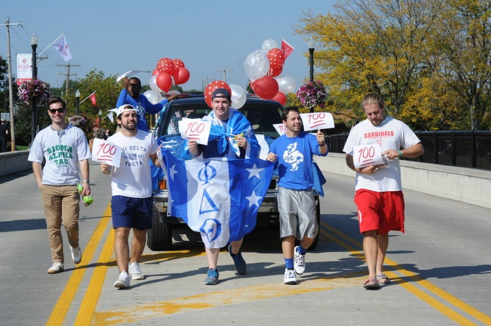 Phi Delta Theta march in Homecoming parade