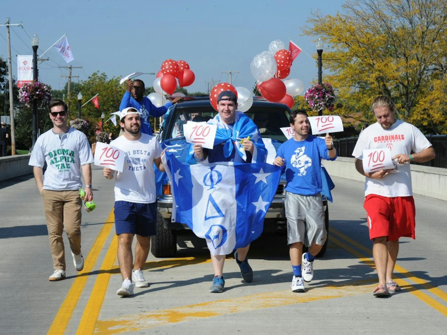 Phi Delta Theta march in Homecoming parade