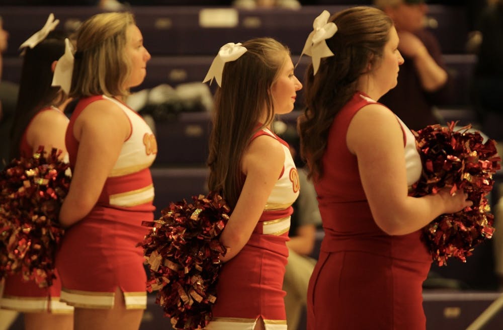 As both of Otterbein's basketball teams traveled to Bexley, the Cardinals' cheerleading squad cheered along the baseline.