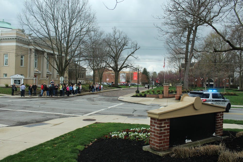 <p>Students evacuated from the science building waited to hear if classes would be canceled.</p>