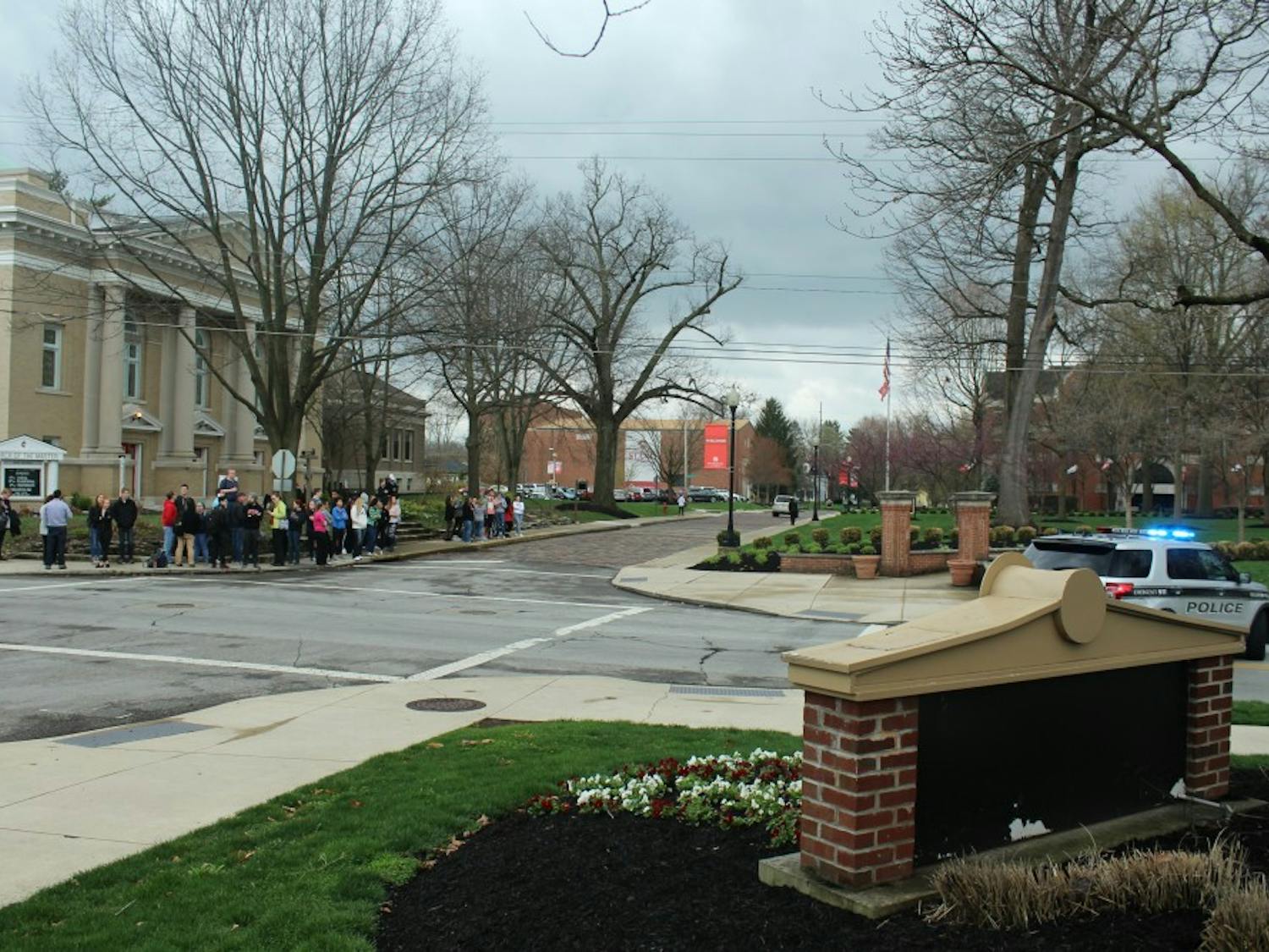 Students evacuated from the science building waited to hear if classes would be canceled.