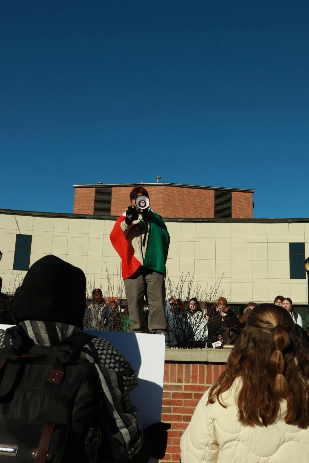 <p>Israel Lopez gives a speech in front of the Campus Center during a protest against ICE on January 20, 2026. Photo by Misael Hernandez</p>