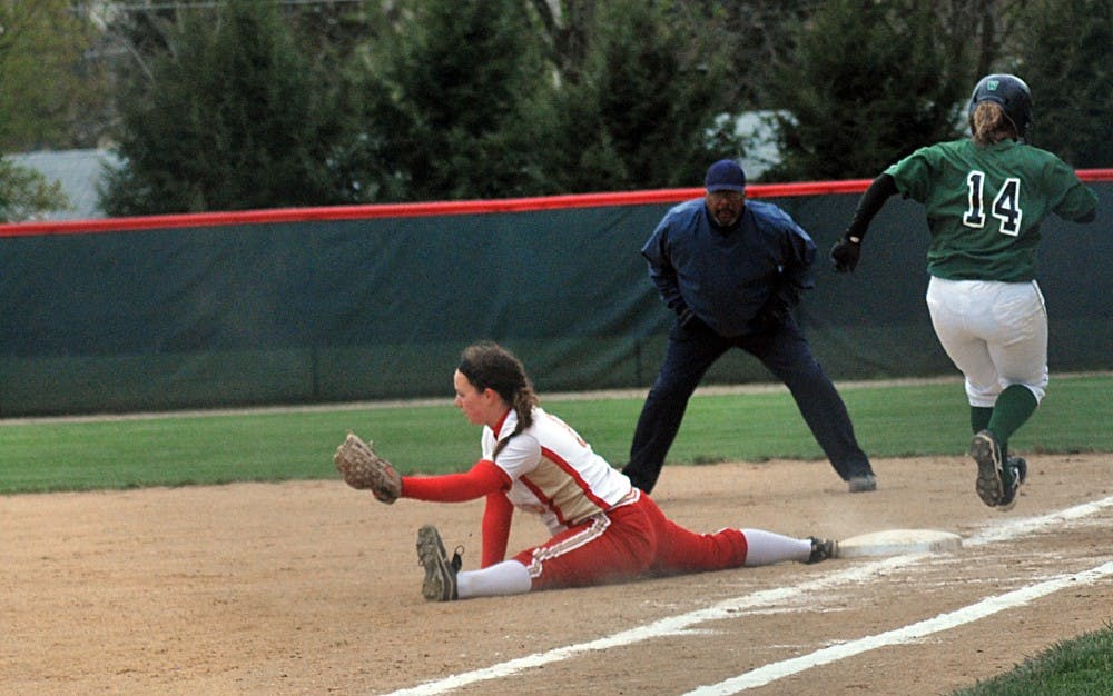 	<p>Freshman Kayla Woodard completely lays herself out at first to attempt the out.</p>