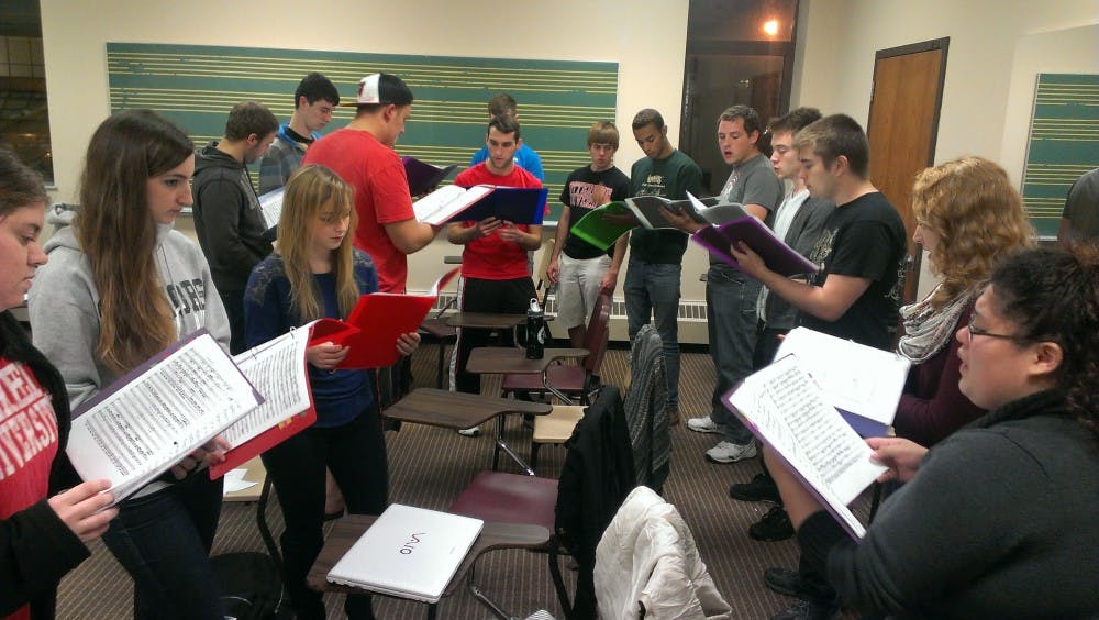 	<p>Some of the members of Otterbein&#8217;s acapella group, Ottertuned, rehearsing their music</p>