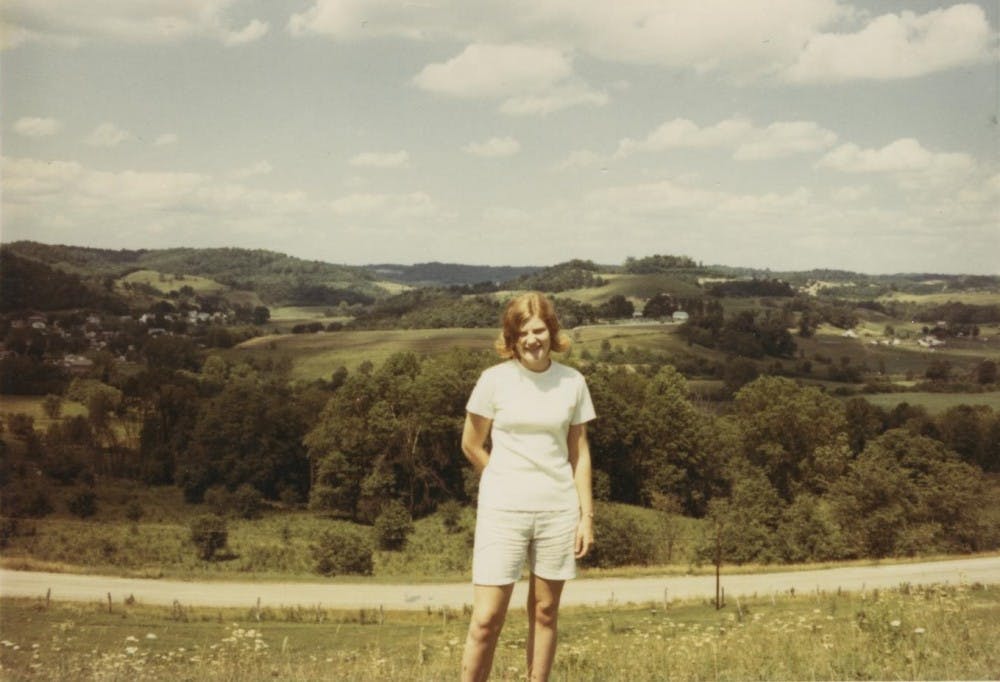 	<p>Daugherty standing on her parents’ hill, overlooking Quaker City, in June 1971. </p>
