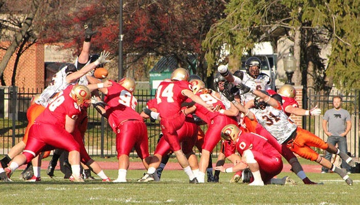 	Nick Ganus sends a kick through the air as Ohio Northern players try to block it last season.