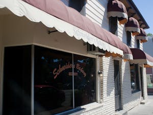 Schneiders Bakery in the daylight: The lines outside form in the early morning hours as the scent of fresh doughnuts fill the air.