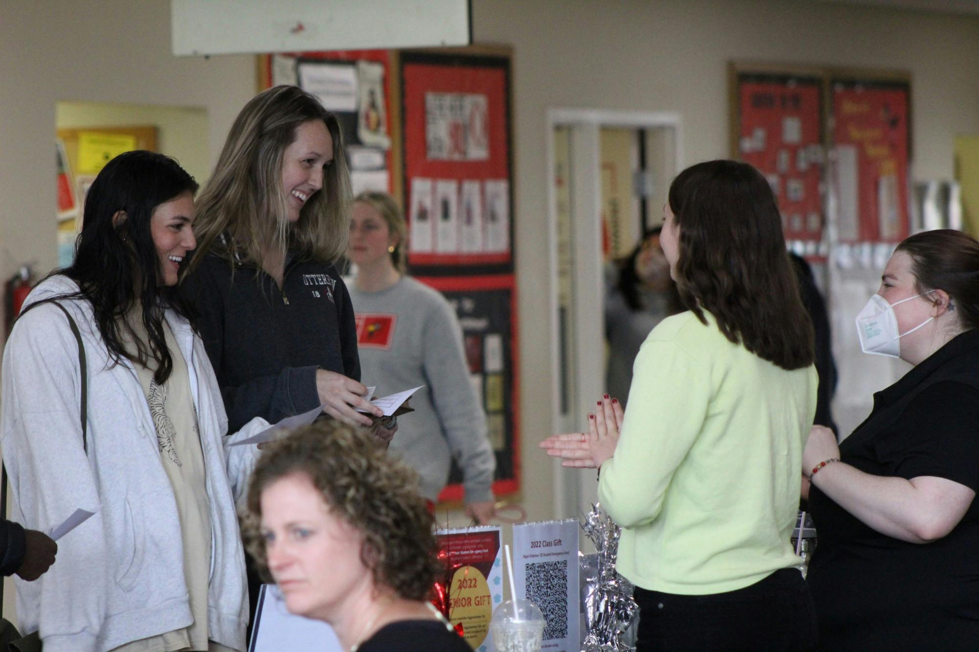 Students pick up their caps and gowns for graduation