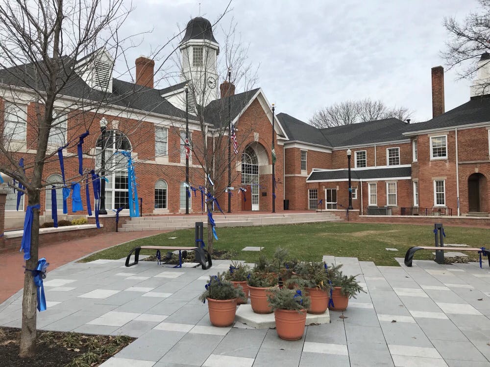 <p>Blue ribbons still hang at City Hall. Eventually the spouses of the fallen officers, Morrelli and Joering, will be able to take them down.</p>