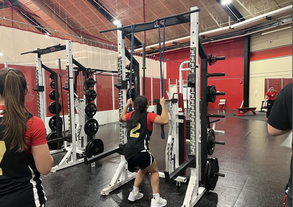 <p>Abby Rawlings, a junior guard on the women's basketball team, practices at the team lift at the Rike Center.</p>