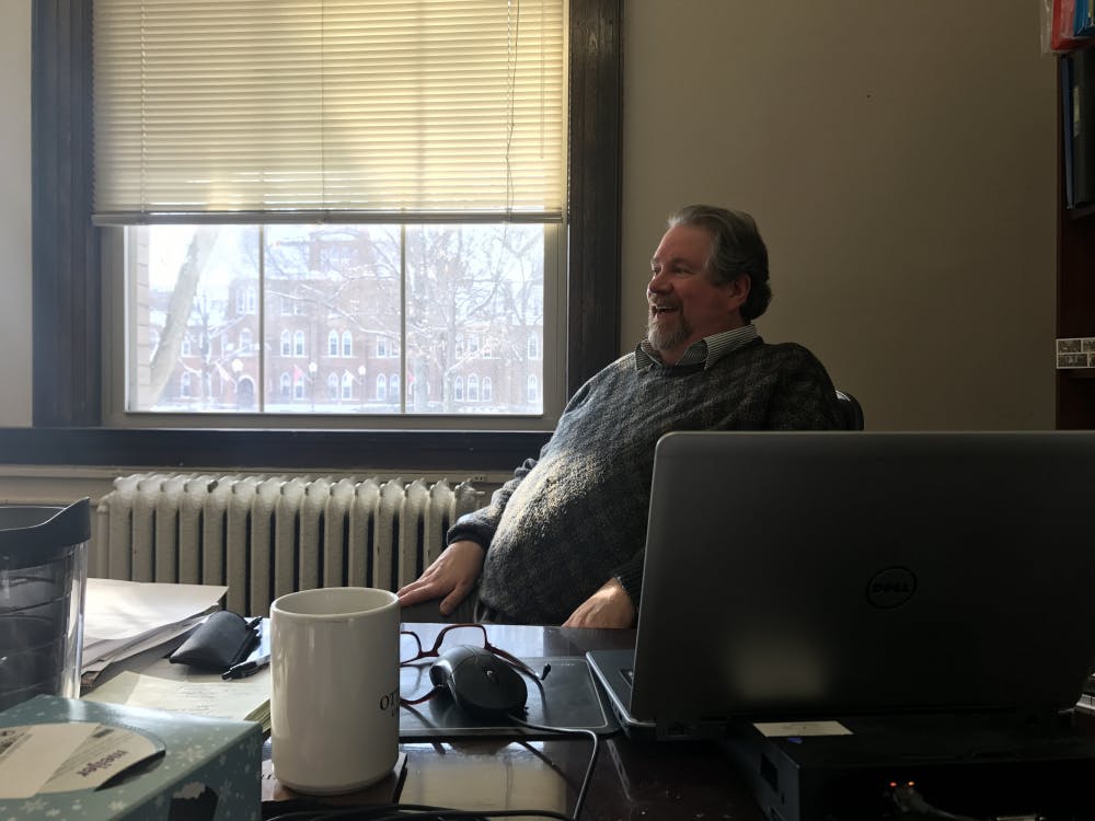 Jefferson Blackburn-Smith at his desk in the admission's office