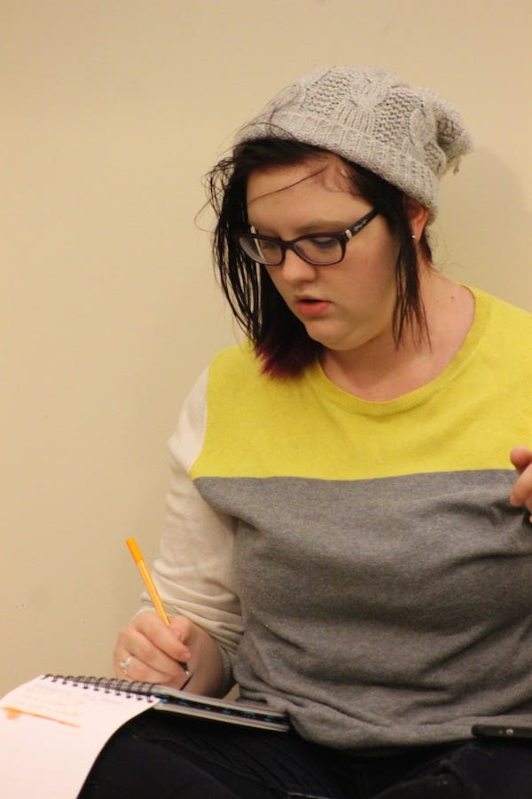 Starving Artists President Addalie Bolyard takes notes at the group's Thursday meeting.