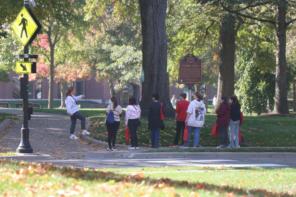 Otterbein tour group in the fall at the crosswalk