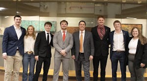 A group of students lined up for a picture with Ohio Secretary of State Frank LaRose.