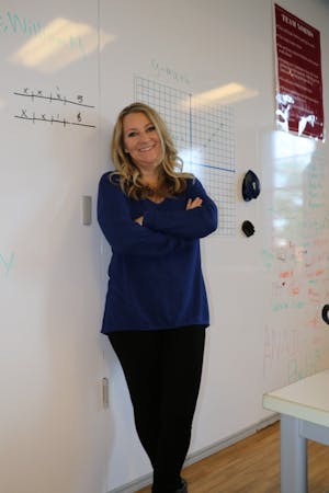 Sandy Light poses in her math classroom