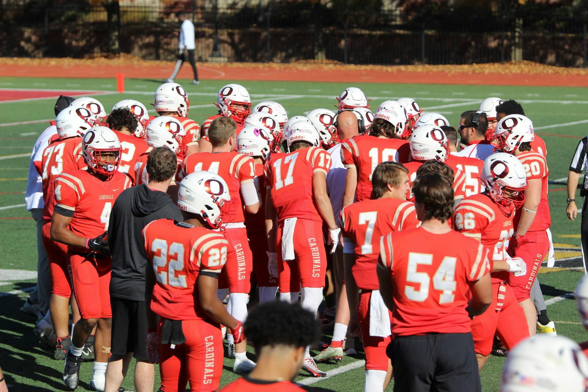 The Otterbein football team huddles up during their Nov. 2 game against Mount Union.