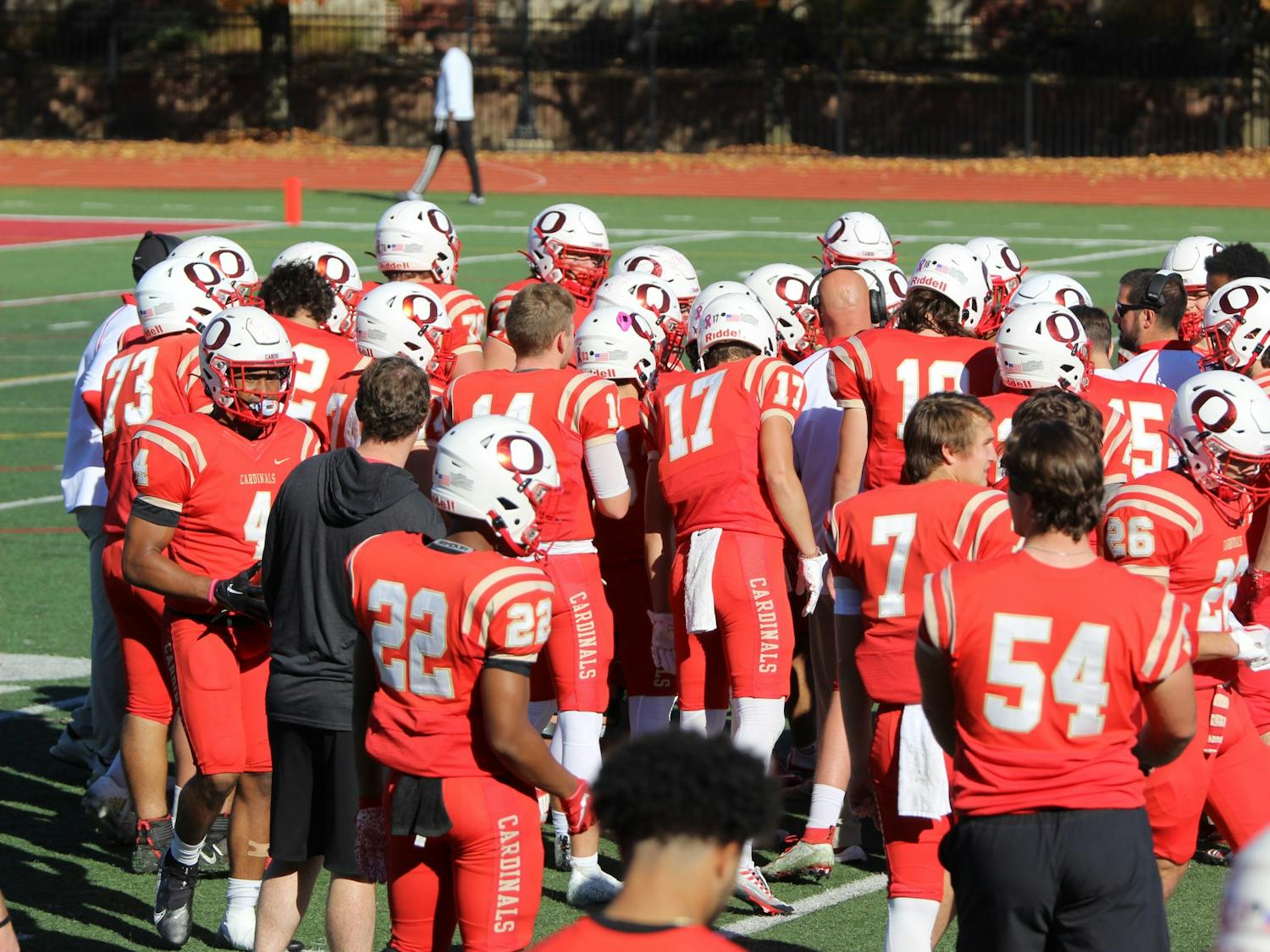 The Otterbein football team huddles up during their Nov. 2 game against Mount Union.