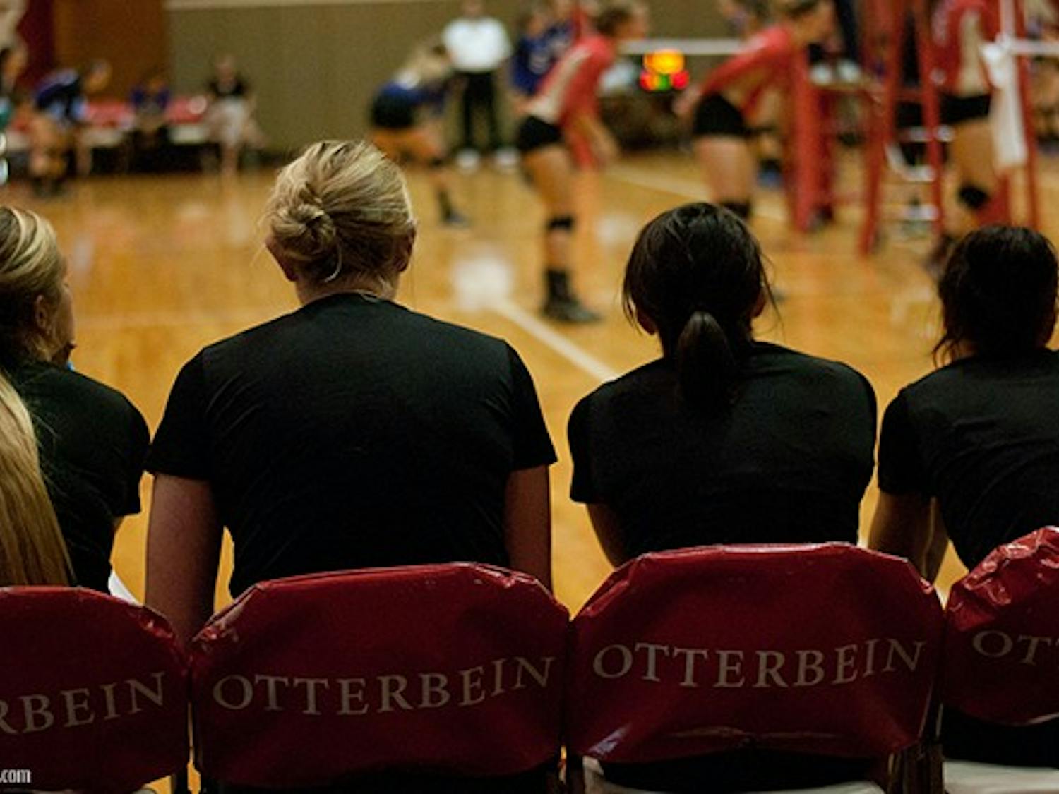 The OC volleyball team coaches watch on as their team continues to dominate the court.
