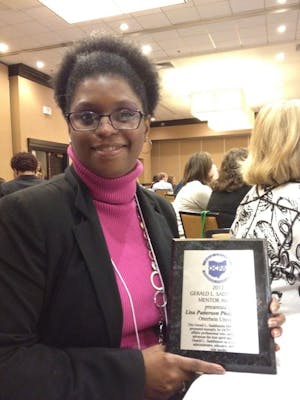 Lisa Patterson Phillips accepts the Gerald L. Saddlemire Mentor Award.