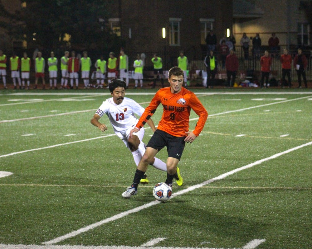 Junior midfielder Tiger Pham fights for possession. 