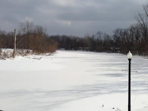Alum Creek appears to be frozen and is completely covered with snow