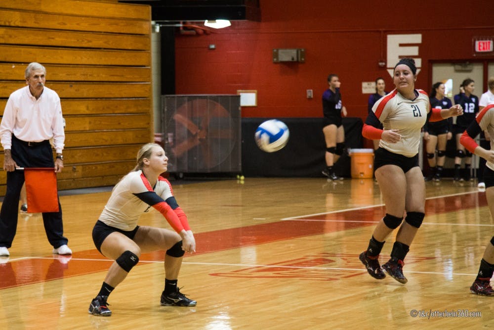 	Sophomore Lauren Beitel gets low for a dig