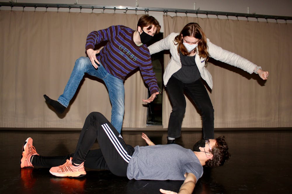 <p>The Otterbein Improv Troupe practices on Feb. 23. Pictured: Luke Maynus (left), Dean Yureka (front), Gracie Guichard (right).</p>