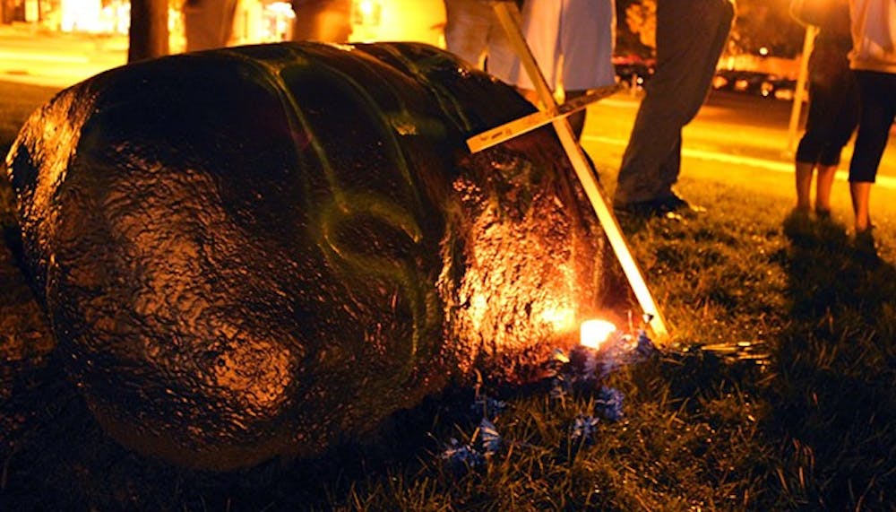 	<p>Students spray painted the Rock to read &#8220;<span class="caps">RIP</span> Scotty,&#8221; placing a wooden cross beside it, after the death of former Otterbein student Scott Harman.</p>