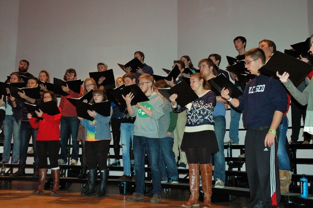 <p>Otterbein Concert Choir rehearsing for their upcoming concert</p>