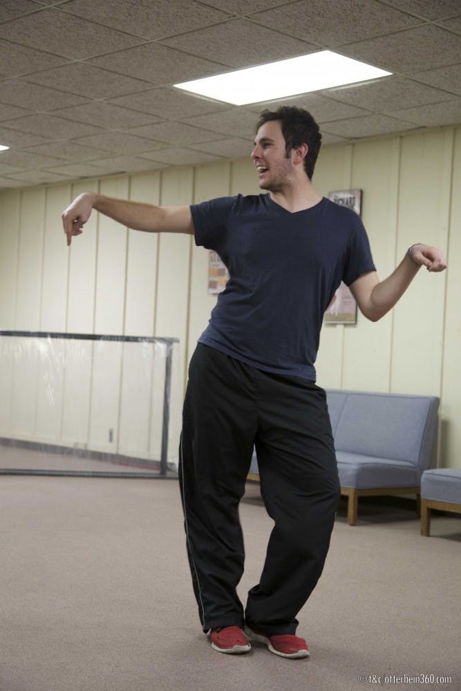 	Paul Dahman acts out a scene during improv rehearsal