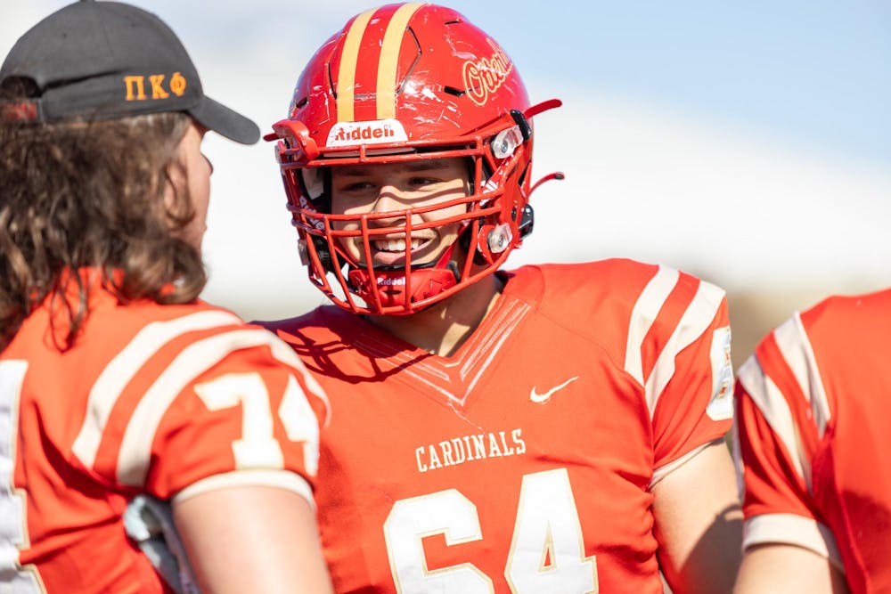 <p>Picture of Zane Gogolin smiling on the sideline at a football game against Capital University on Oct. 26, 2024. Photo taken by Marvet Hezajin.</p>