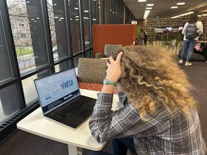 Staged- student sitting in the library.jpg