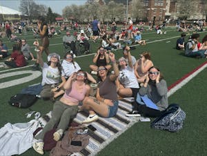Otterbein Cardinals Gaze up as the Solar Eclipse Slowly Comes into View.