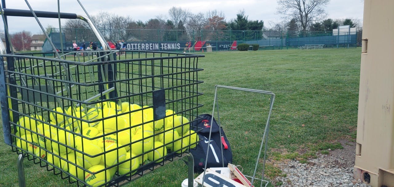 Tennis balls are set out before practice