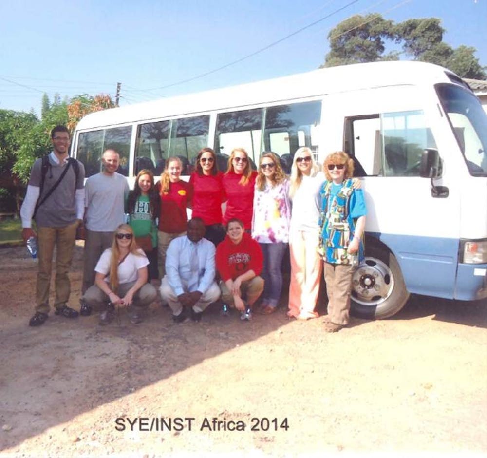 <p>Students and faculty of the Spring 2014 study abroad trip to Malawi, Africa with their guide Justice who is pictured in the front row in the center. Photo provided by Matt Hofacre.</p>