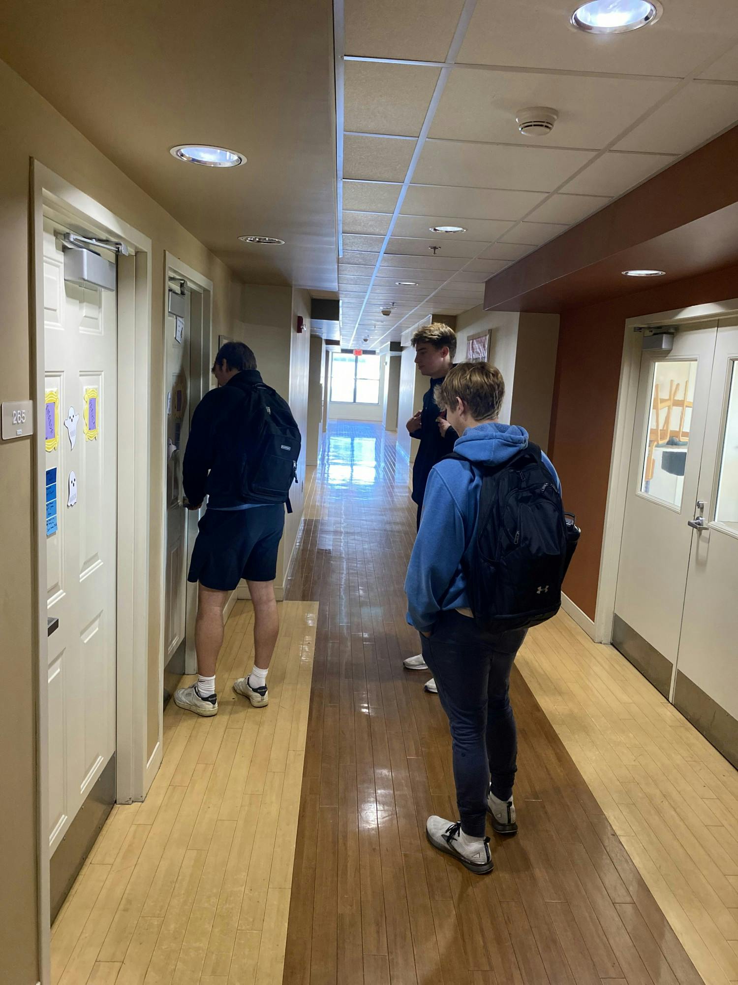 Sophomores Mark Wischmeyr, Luke Crockett and Tord Heskestad enter their room at 25 W. Home St.