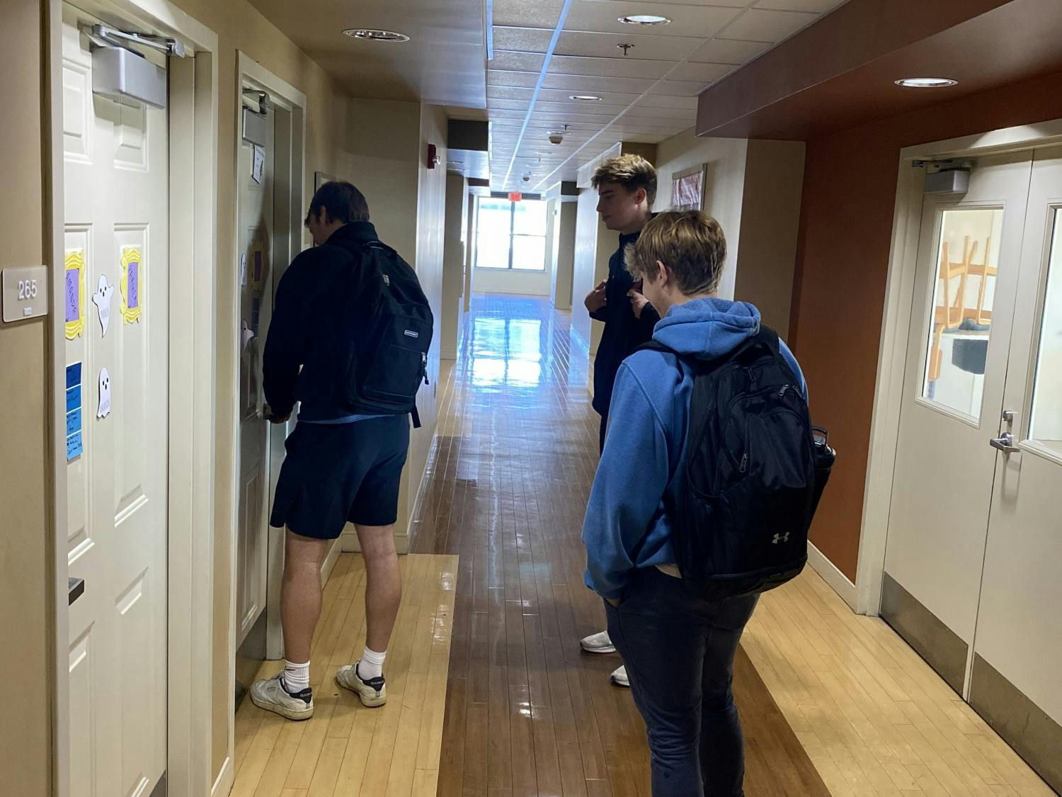 Sophomores Mark Wischmeyr, Luke Crockett and Tord Heskestad enter their room at 25 W. Home St.