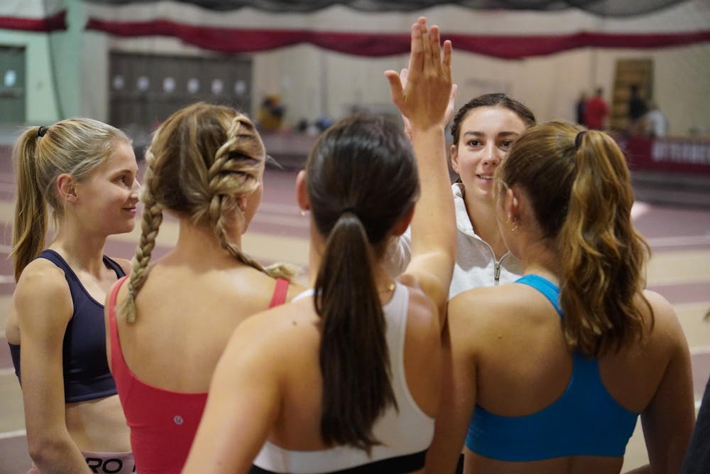 <p>The women's track team comes together before practice</p>