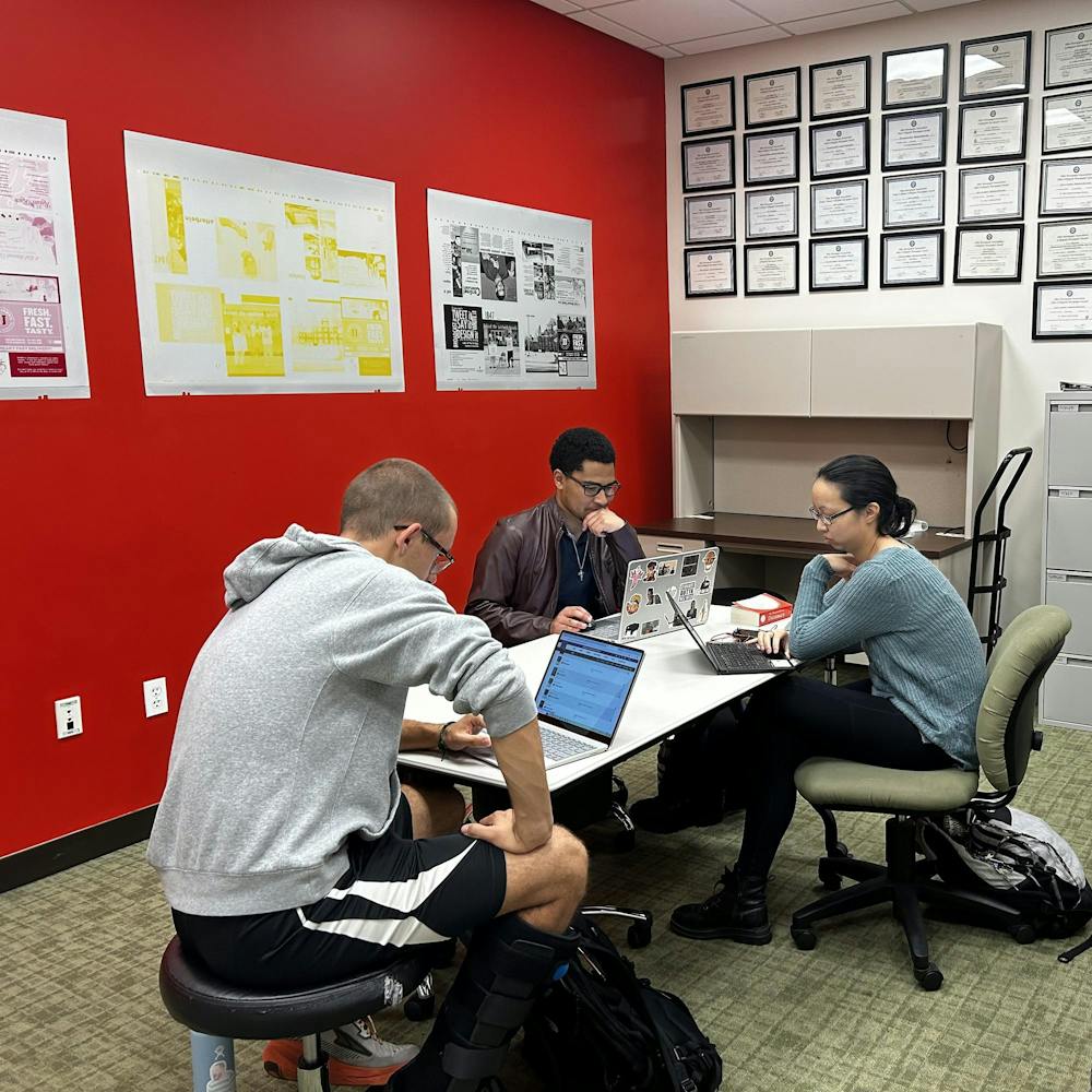 (left to right) Garett Lucius, Dalton Mosley and Amanda Stevens working in the T&C office. 