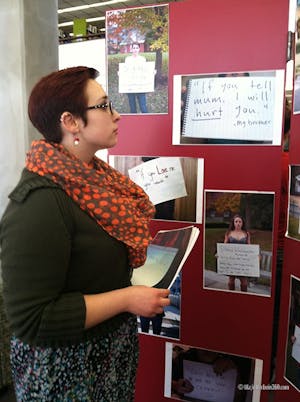 Sachi Berry, a junior religion major, helped set up Project Unbreakable in the second floor of the Courtright Memorial Library. Project Unbreakable kicked off One Billion Rising at Otterbein.