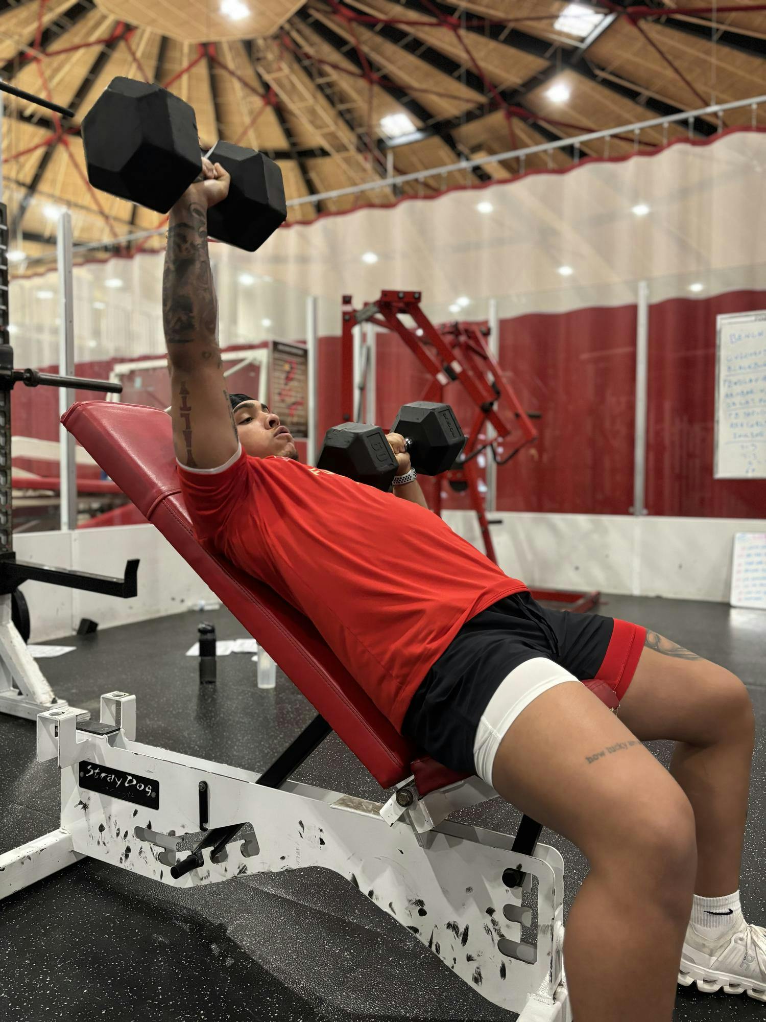 Transfer football player lifting in the weight room